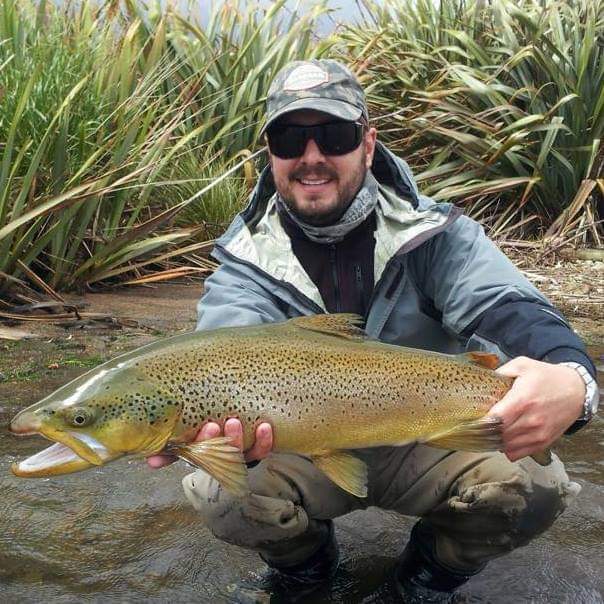 Dave Wickham, Tourism Operations Manager holding a fish from Poronui Lodge