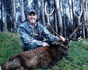 Happy hunter showing his trophy at Poronui